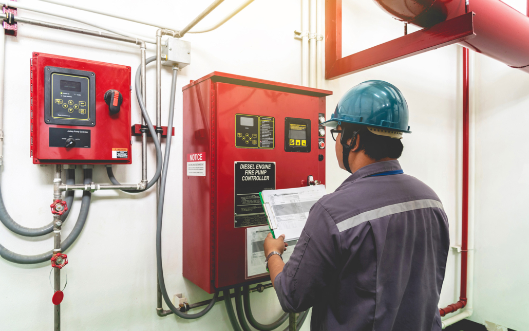 Worker Inspecting Alarm System