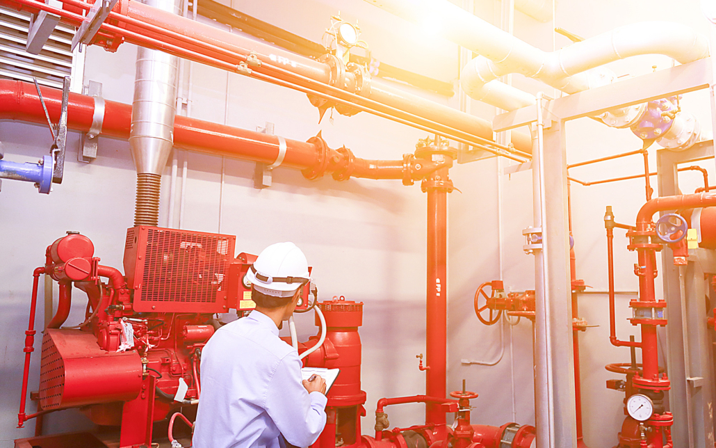 Worker Inspecting Fire Pipes