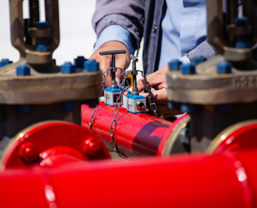 Worker Inspecting Hydrant Pipes