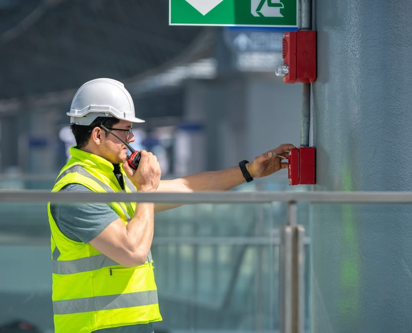 Worker Testing Alarm